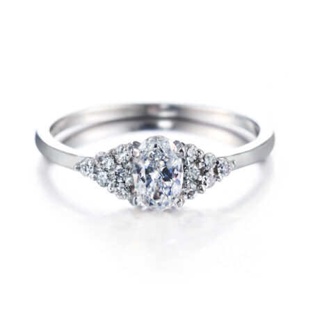 Isla ovaali 12 sivukivellä vihkisormus valkokulta