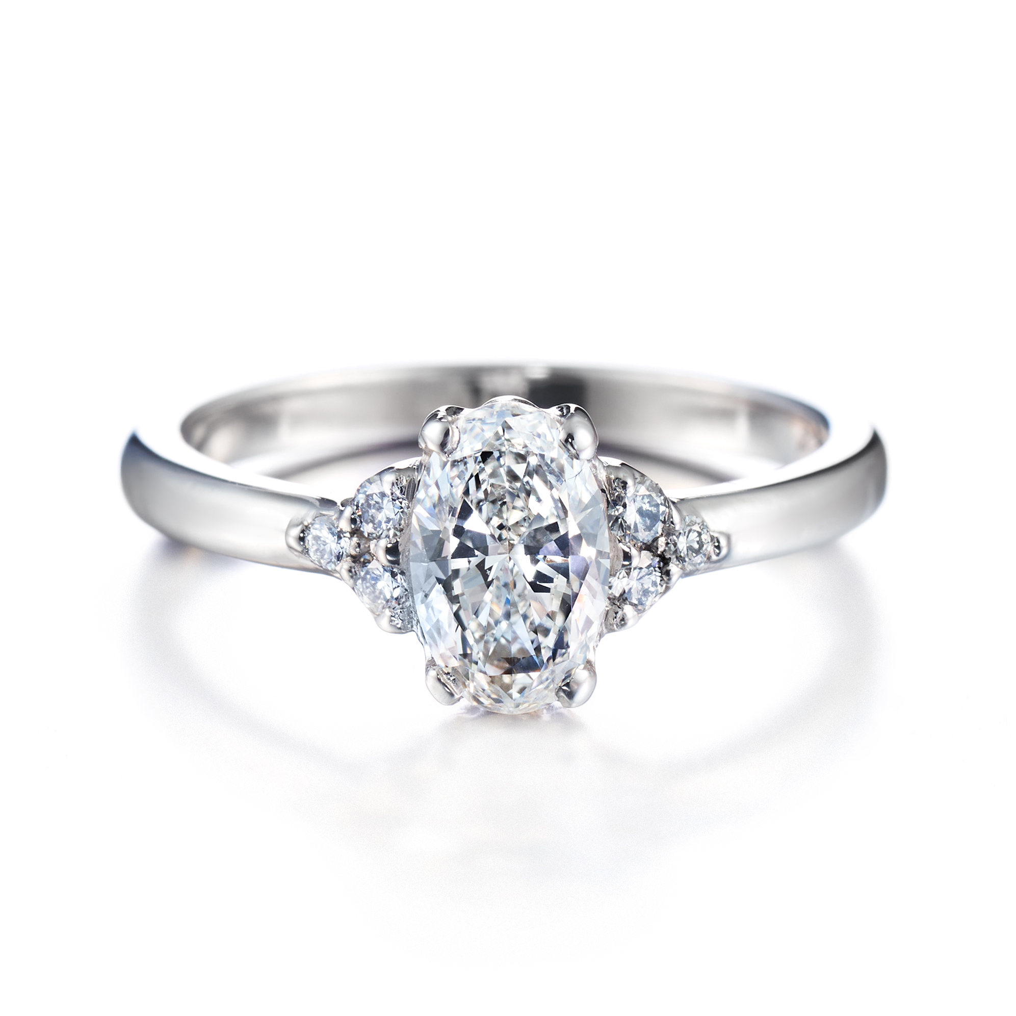 Isla ovaali 6 sivukivellä vihkisormus valkokulta